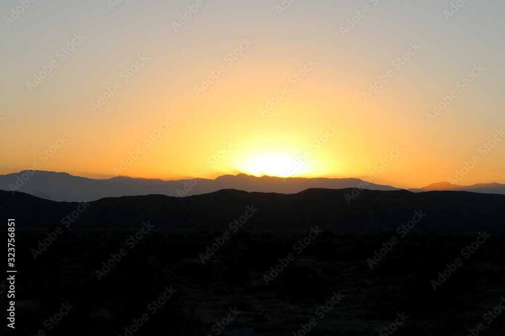 desert mountain yellow orange sunset silhouette
