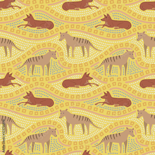 Seamless pattern of dingo dog and tasmanian wolf with ethnic ornament. Australian repetitive textile vector print or wallpaper design. photo