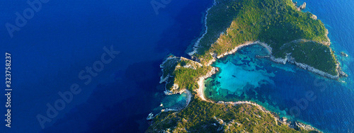 Aerial drone ultra wide photo of famous double paradise azure beach of Porto Timoni in Northern part of Corfu island, Ionian, Greece