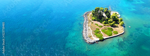 Aerial drone ultra wide photo of iconic small island of Pontikonisi or Mouse island in area of Kanoni, Corfu island, Ionian, Greece photo