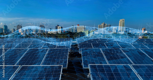 Obraz na płótnie Smart green city concept.solar panels linkage to the city need power. Green energy for the city. w salonie