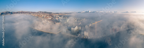 A great view of Bodø city as seen from above the clouds. photo