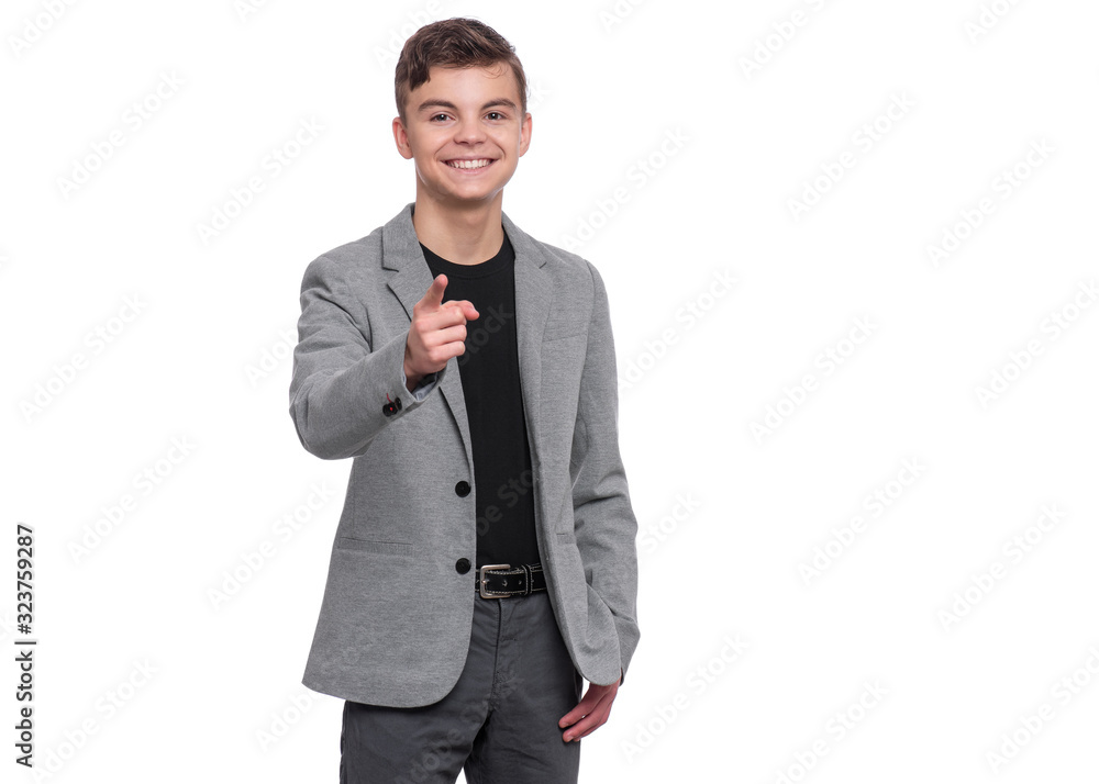 Emotional portrait of Handsome caucasian Teen Boy in suit laughing and pointing finger to you. Funny cute smiling child 15 year old looking at camera choosing you, isolated on white background. Emotional portrait of Handsome caucasian Teen Boy in suit laughing and pointing finger to you. Funny cute smiling child 15 year old looking at camera choosing you, isolated on white background.