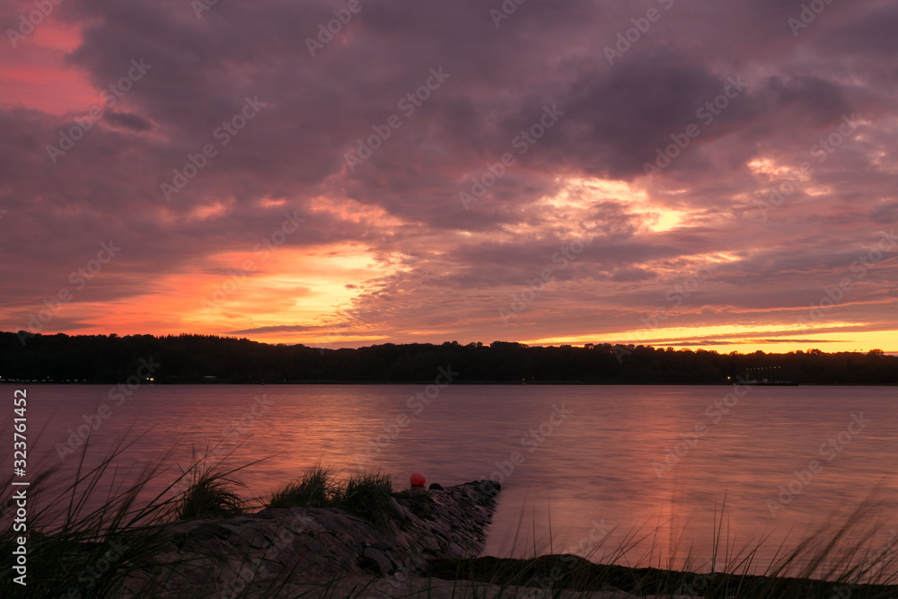 scenic seascape with red sky at dawn