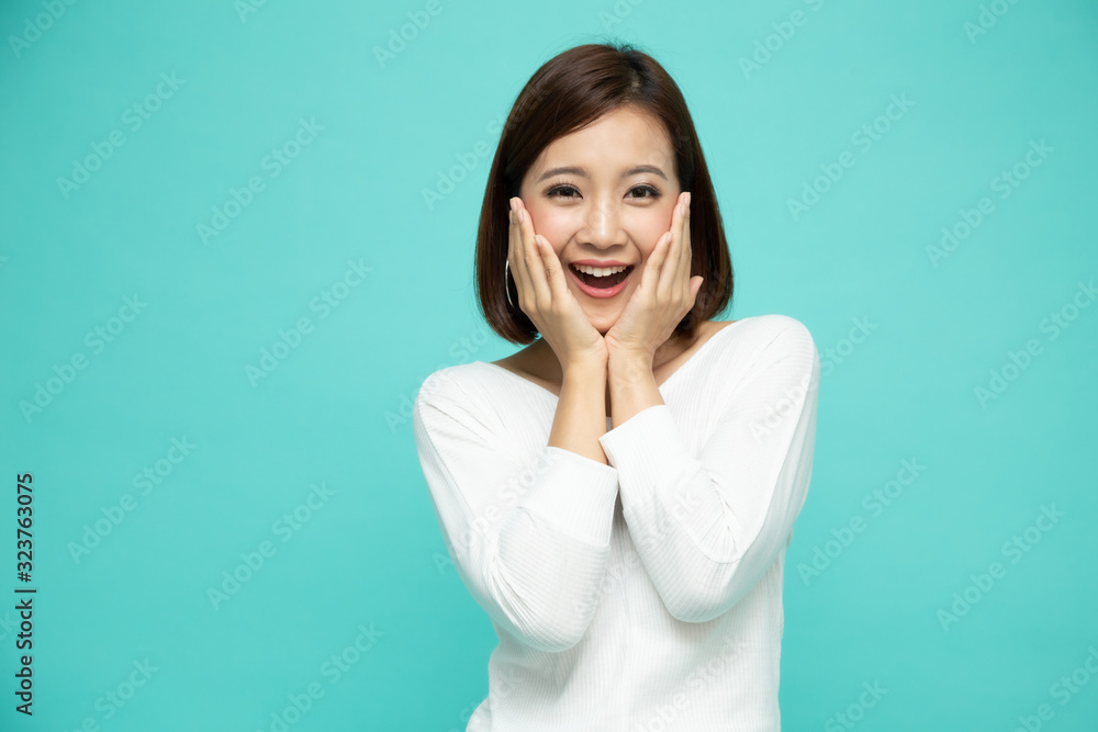 Portrait of excited screaming young asian woman standing isolated over green background, Wow and surprised concept Portrait of excited screaming young asian woman standing isolated over green background, Wow and surprised concept