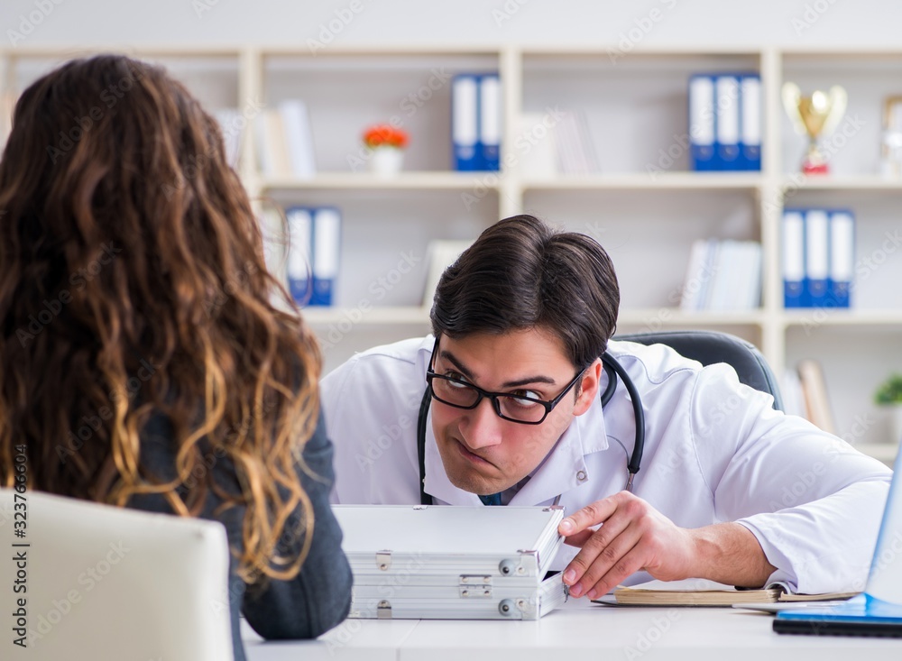 Young doctor in medical insurance fraud concept Young doctor in medical insurance fraud concept