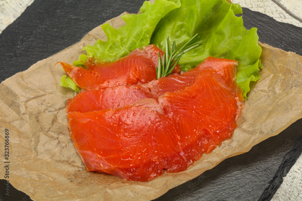 Sliced salmon fillet served rosemary Sliced salmon fillet served rosemary