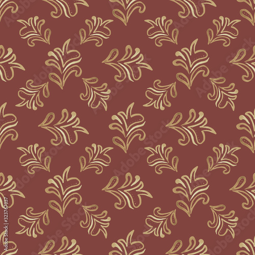 Seamless patterns of fancy hand-drawn beige-gold leaves on a terracotta background. Beautiful design in retro style for wallpaper, fabric, packaging materials, textile, scrapbooking, printing, decor