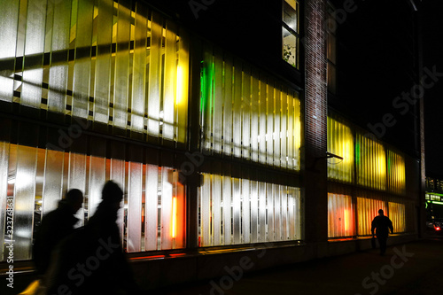 Photography Stockholm, Sweden Pedestrians at night in the parking lot of the Sickla shopping center