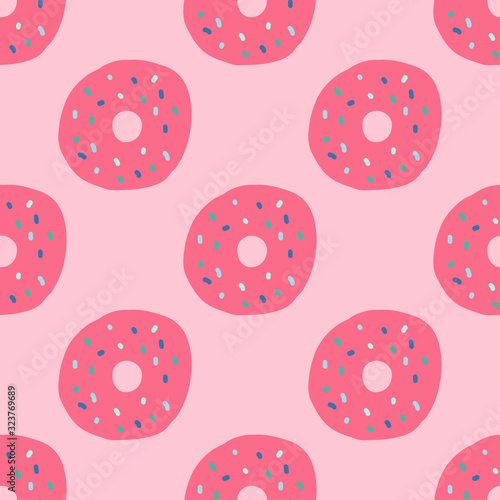 Pink doughnuts seamless repeat pattern for wrapping paper.