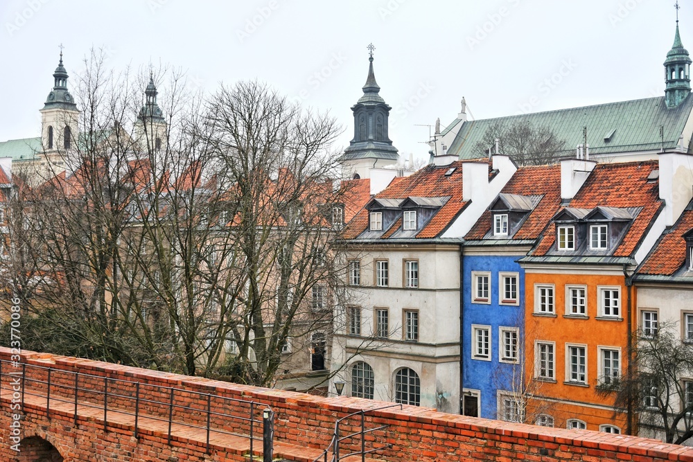 Warsaw, Poland - January 2020. Beautiful multi-colored houses in the old town in Warsaw.  The central streets of the historic center of Warsaw. The main tourist attraction of Warsaw. Cityscape 