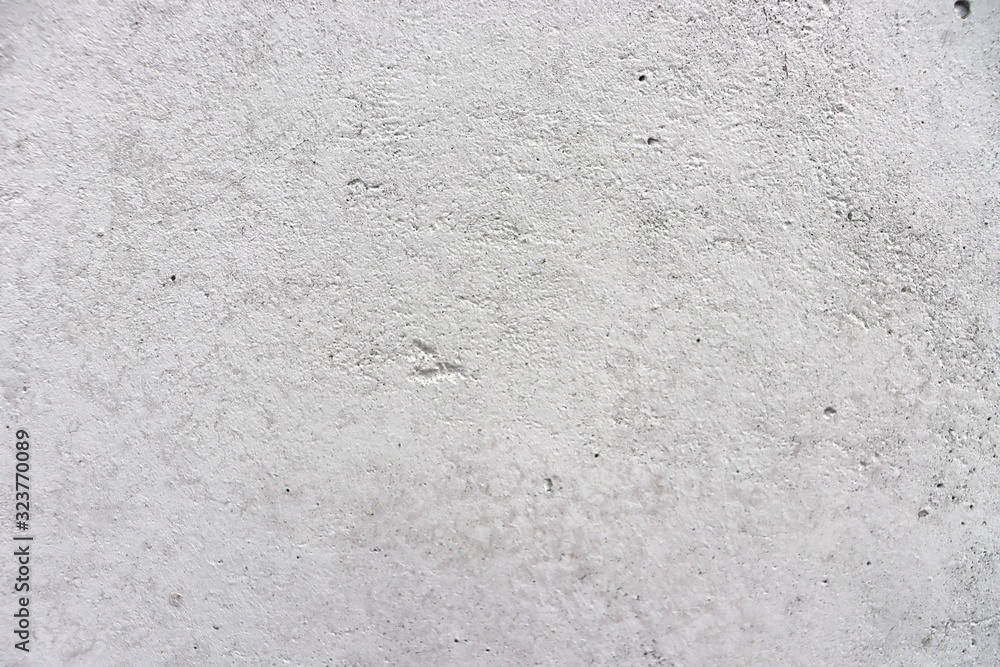 Background of white concrete wall. Uneven concrete wall. Background of white concrete wall. Uneven concrete wall.