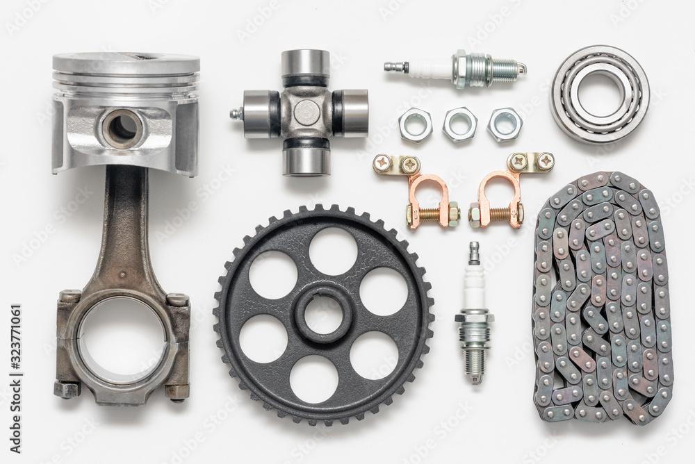 © Dmitriy - Car spare parts on gray background top view.
