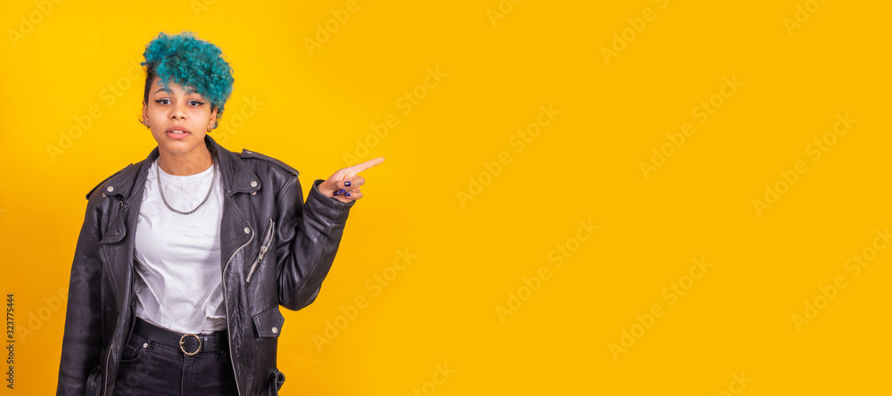 young afro american girl isolated on color background pointing space young afro american girl isolated on color background pointing space