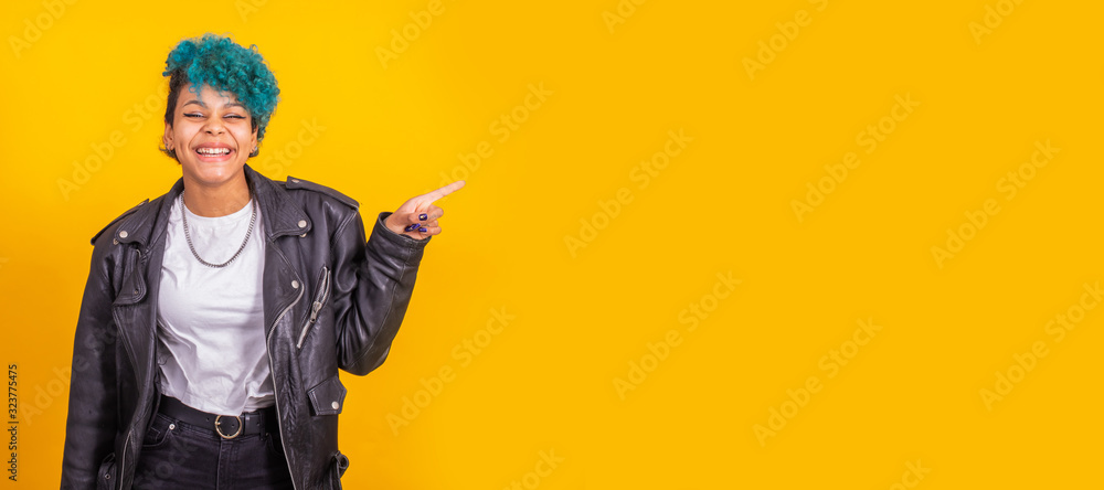 young afro american girl isolated on color background pointing space young afro american girl isolated on color background pointing space