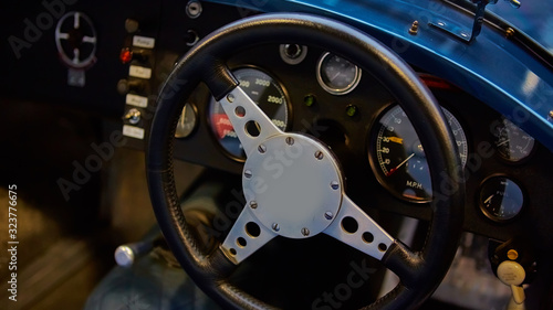Details of interior classic car. Classic car steering wheel
