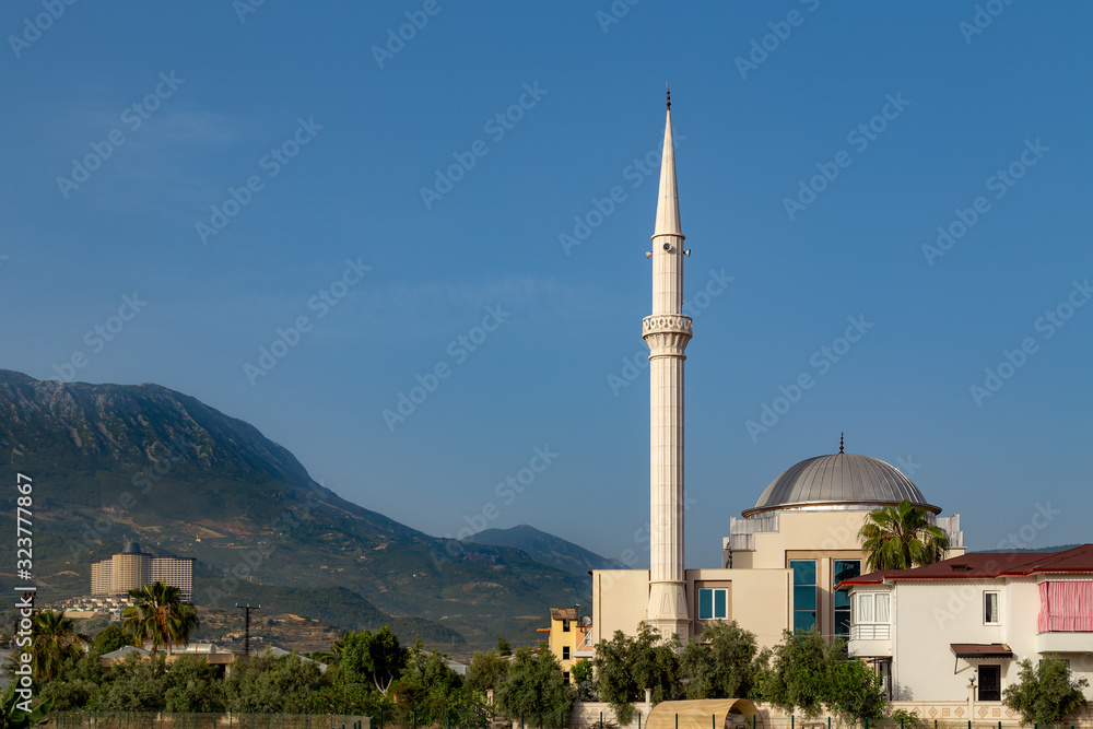 Fototapeta premium Small mosque in the mountains with one minaret.
