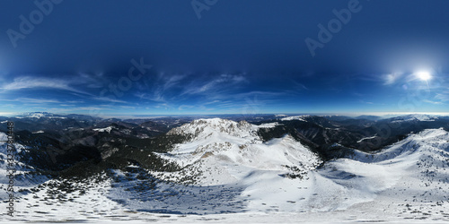 Aerial 360 degrees drone panorama of Ciucas Mountains in winter season.