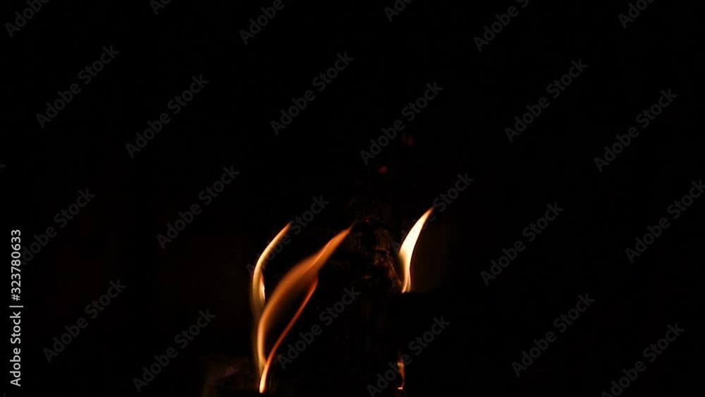 Flames Licking Around a Log in a Fireplace and getting Brighter - Slow Motion Flames Licking Around a Log in a Fireplace and getting Brighter - Slow Motion