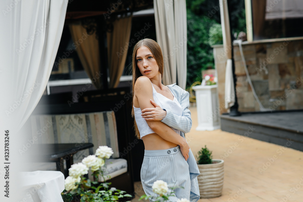 Naklejka premium Beautiful young girl posing while relaxing, business woman. Relaxation.