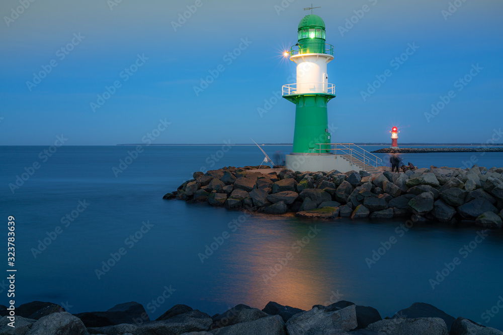 green lighthouse in the evening at baltic sea