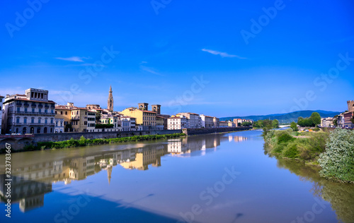 A daytime view along the Arno River in Florence  Italy.