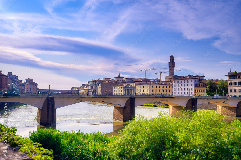 A view along the Arno River towards the Ponte Vecchio in Florence, Italy.