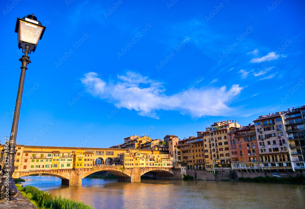 A view along the Arno River towards the Ponte Vecchio in Florence, Italy.