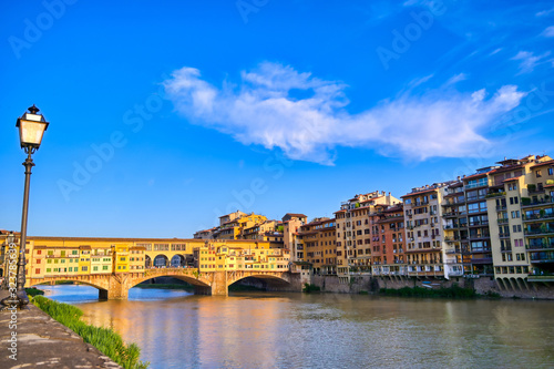 A view along the Arno River towards the Ponte Vecchio in Florence, Italy.