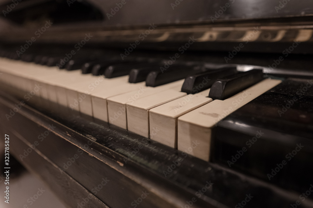The keys of an old black piano The keys of an old black piano