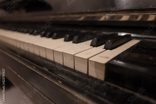 The keys of an old black piano
