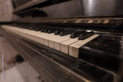 The keys of an old black piano