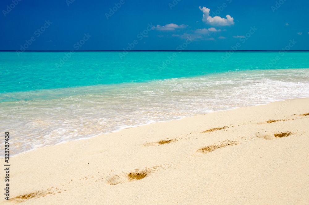 Tropical white sand beach, turquoise water and blue sky. Tropical white sand beach, turquoise water and blue sky.