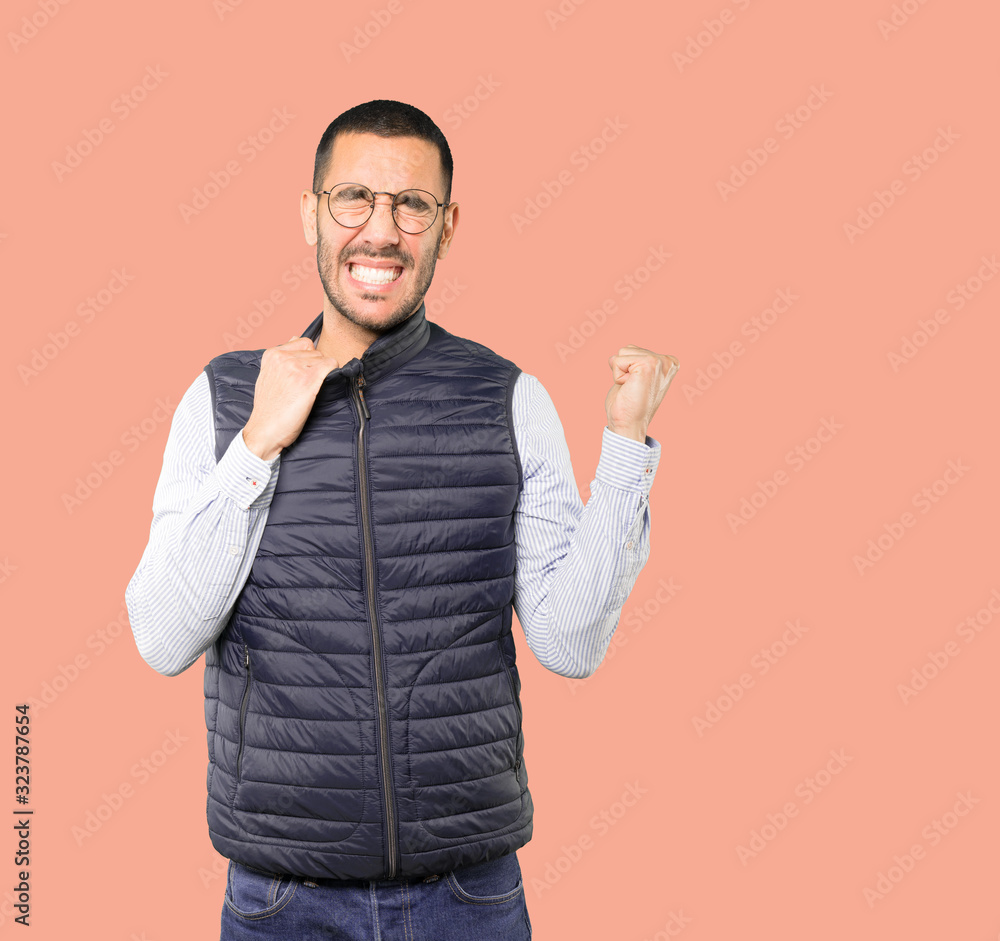Depressed young man doing a gesture of stress Depressed young man doing a gesture of stress