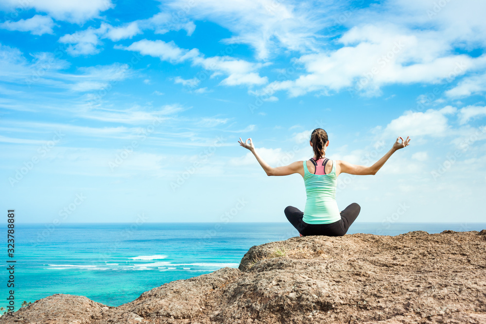 Woman meditating finding peace in nature. Woman meditating finding peace in nature.
