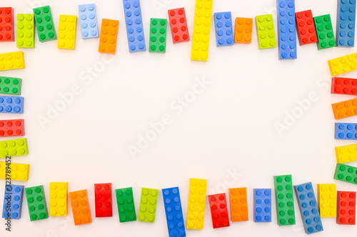 Plastic bricks for kids in different colors on the table