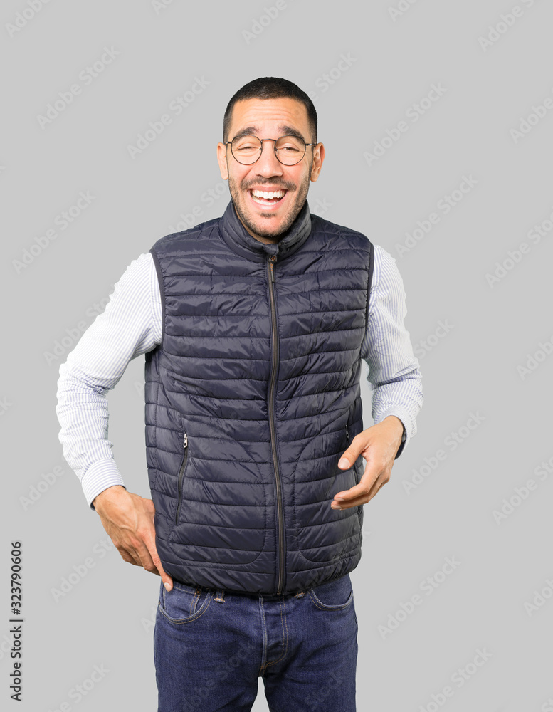 Fototapeta premium Amazed young man looking up gesture