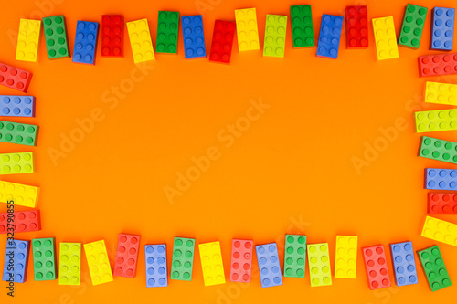 Wallpaper Mural Plastic bricks for kids in different colors on the table Torontodigital.ca