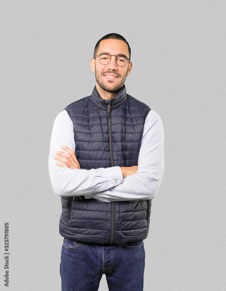 Satisfied young man with crossed arms gesture Satisfied young man with crossed arms gesture