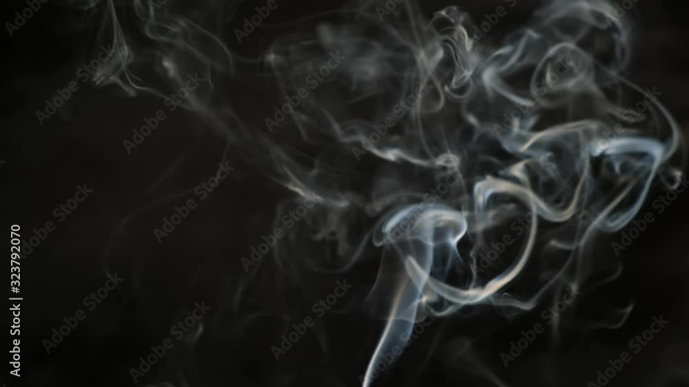 White stream of smoke on black background. Beautiful wobble. Close up. White stream of smoke on black background. Beautiful wobble. Close up.
