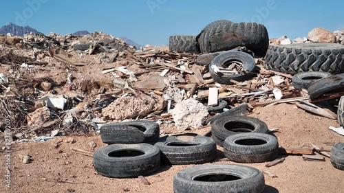 Tyres lies on the dump, abuse of environment photo