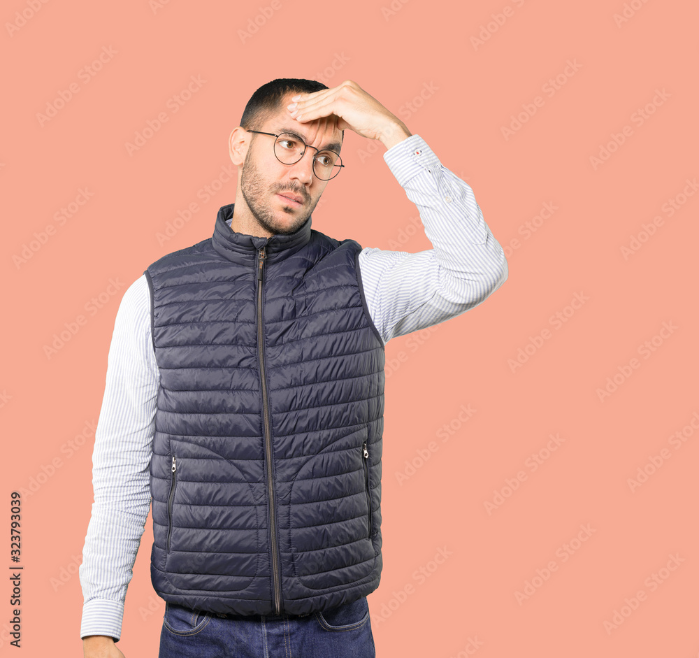 Concerned young man with a stress gesture Concerned young man with a stress gesture