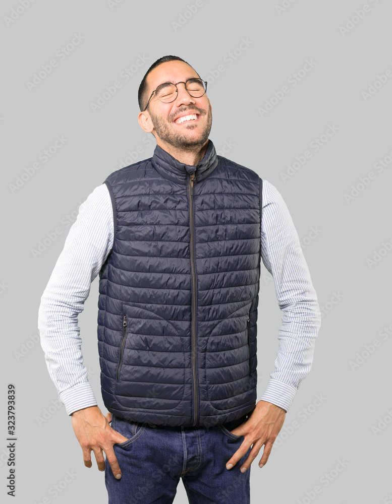 Happy young man laughing