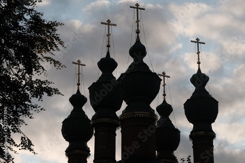 Backlight Christian domes against the sky photo