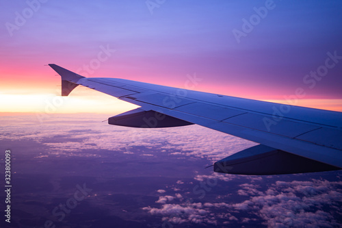 wing view plane in the sky sunrise