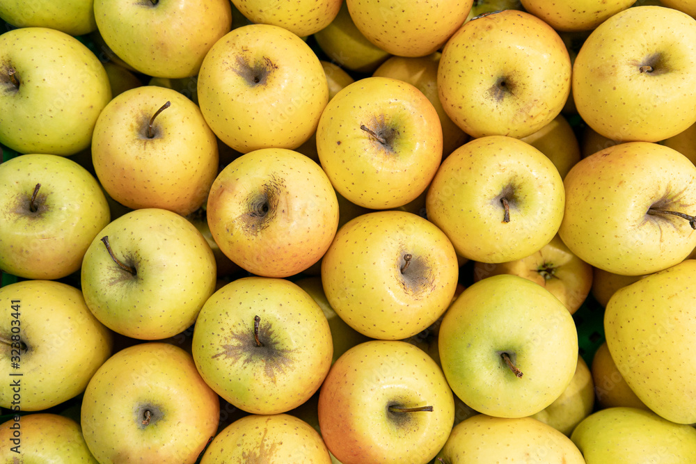 Basket with fresh ripe green apple fruits on sale in grocery food store.Supermarket shop,natural foods department.Eat vitamines Basket with fresh ripe green apple fruits on sale in grocery food store.Supermarket shop,natural foods department.Eat vitamines