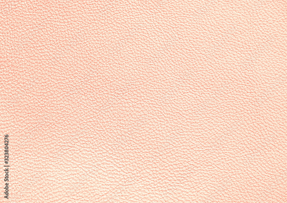 The texture of genuine leather. Pink background. The texture of genuine leather. Pink background.
