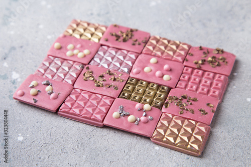 Pink ruby chocolate bars with gold, silver and crisp