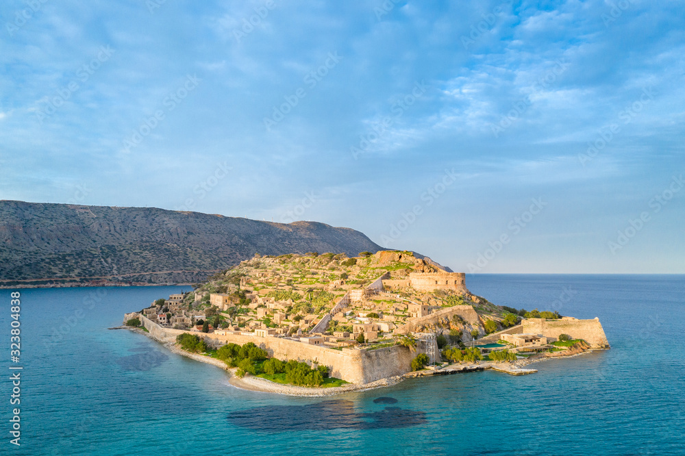 Aerial view of the island of Spinalonga with calm sea. Here were isolated lepers, humans with the Hansen's desease, gulf of Elounda, Crete, Greece.