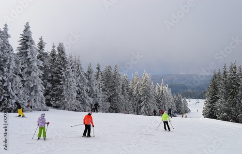 skiers on the trail on the mountain